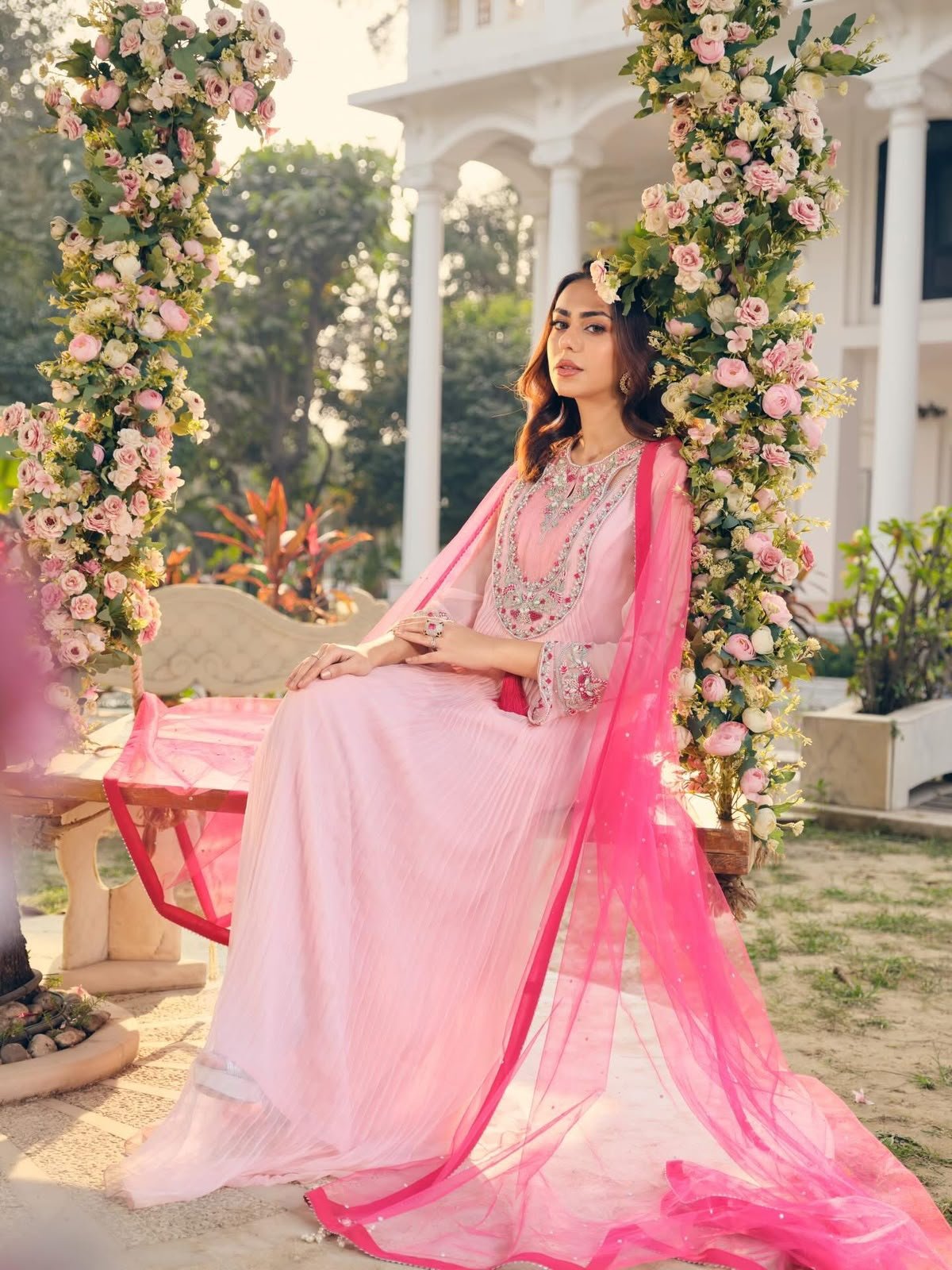 Floral swing setup on the garden lawn
